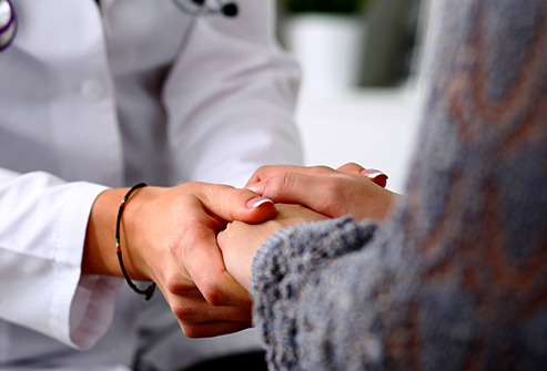 doctor consoling patient